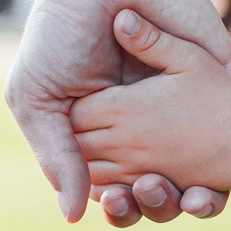 Child holding hand